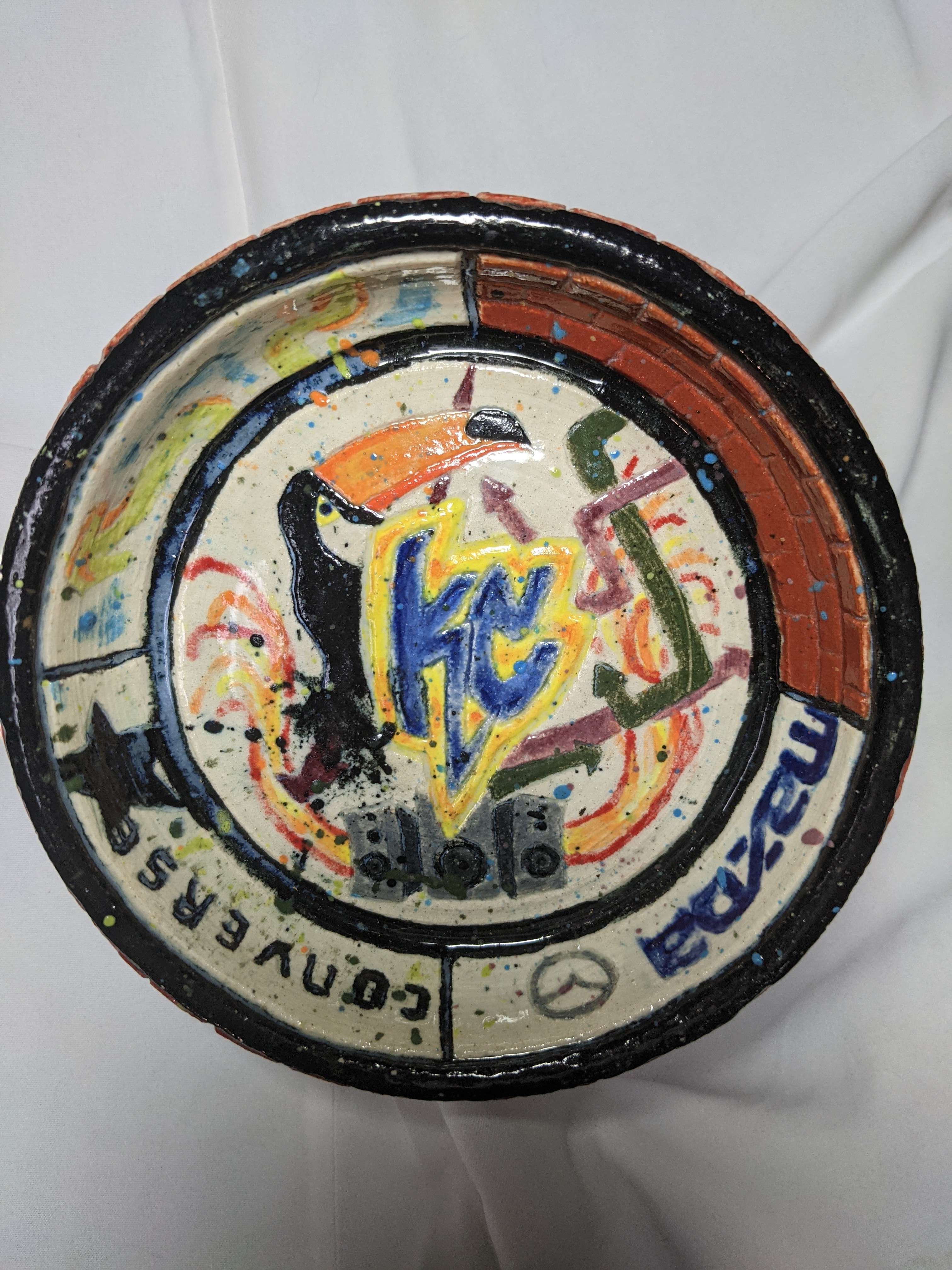 Hand-painted circular found-object artwork