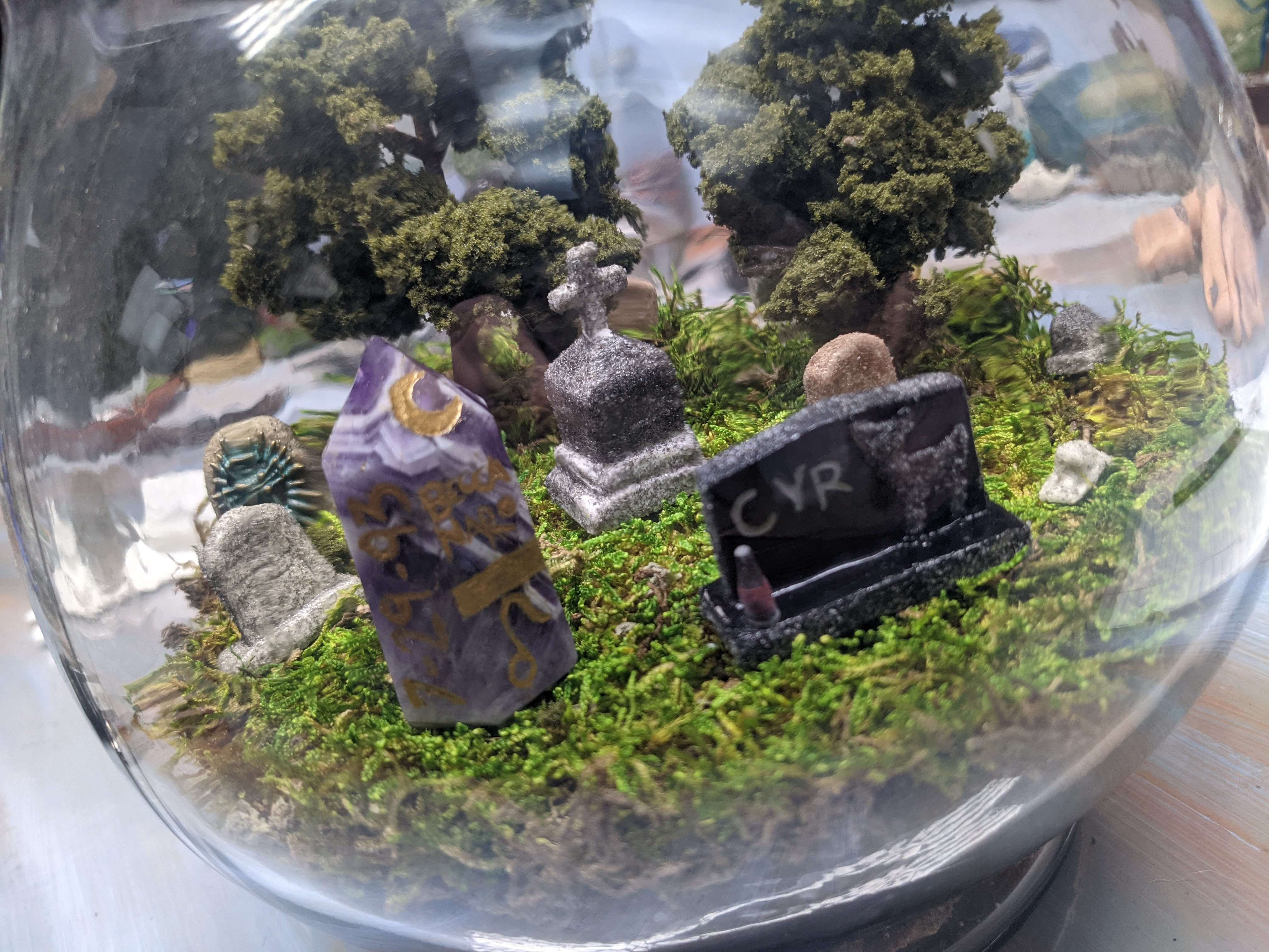 Miniature cemetery terrarium under glass, headstones sculpted in rememberance of loved ones, made official with cremained ashes and hallowed dirt