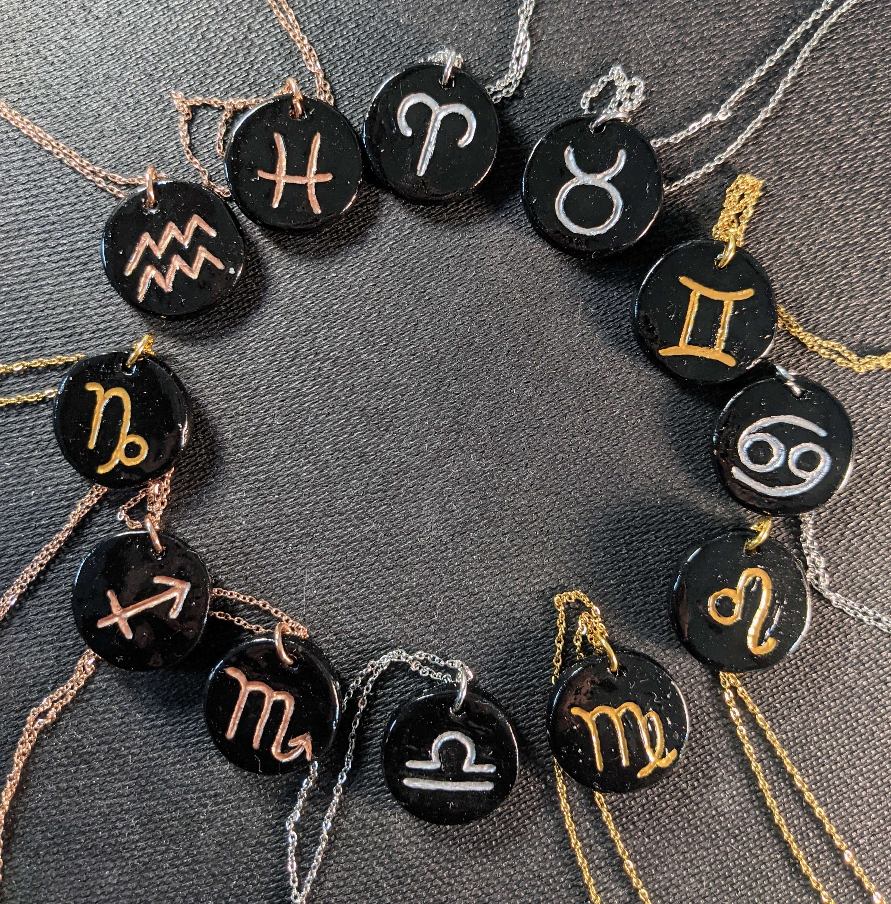 Zodiac symbol pendants arranged in a circle