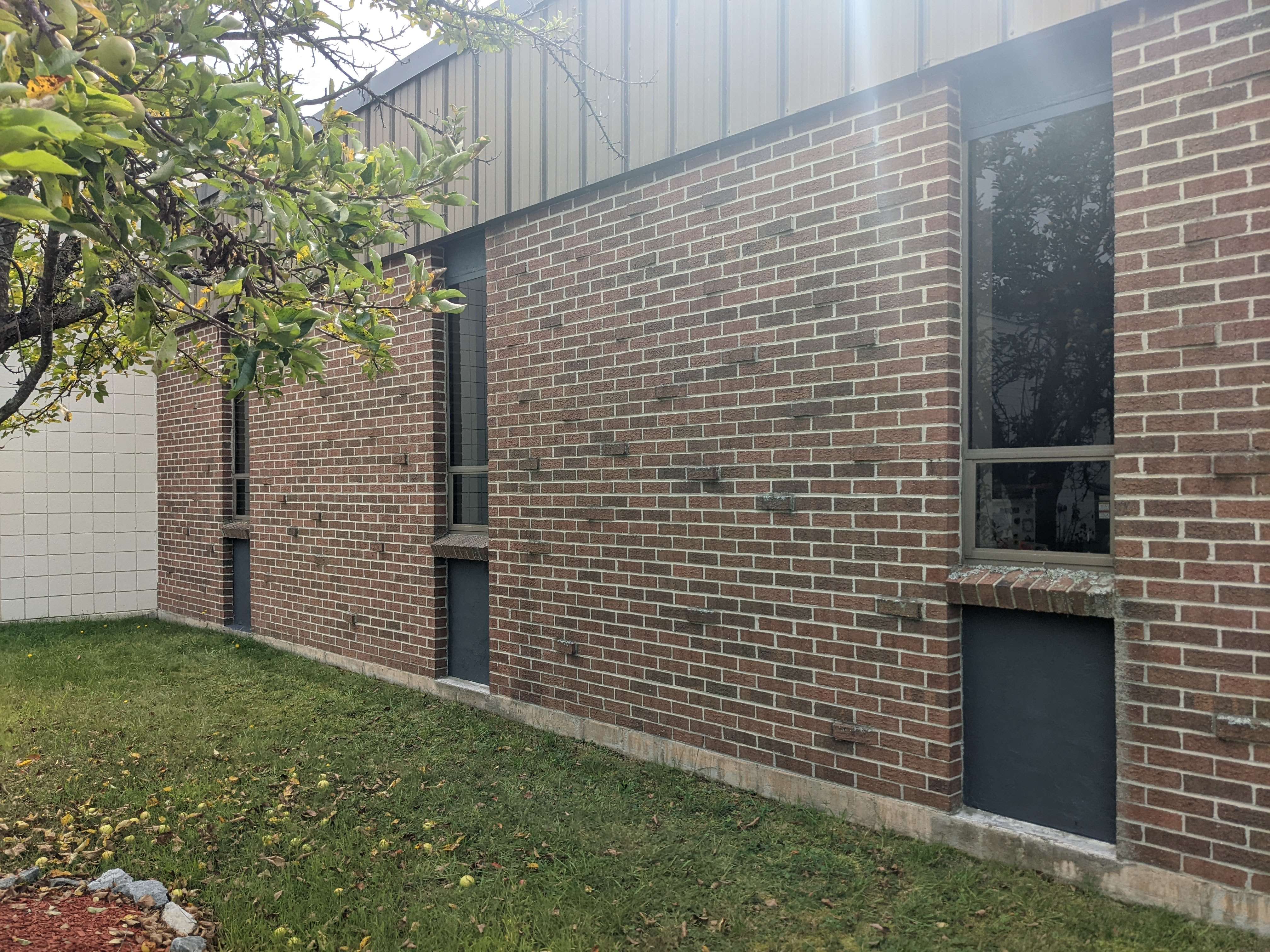 A second exterior window surround before painting